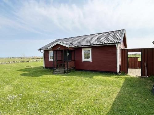 Red cozy cottage with sea view